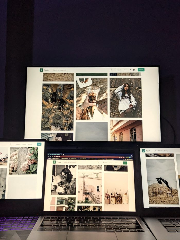 Four screens side by side, each running a different feed of posts: the network of accounts that carries one brand's clips